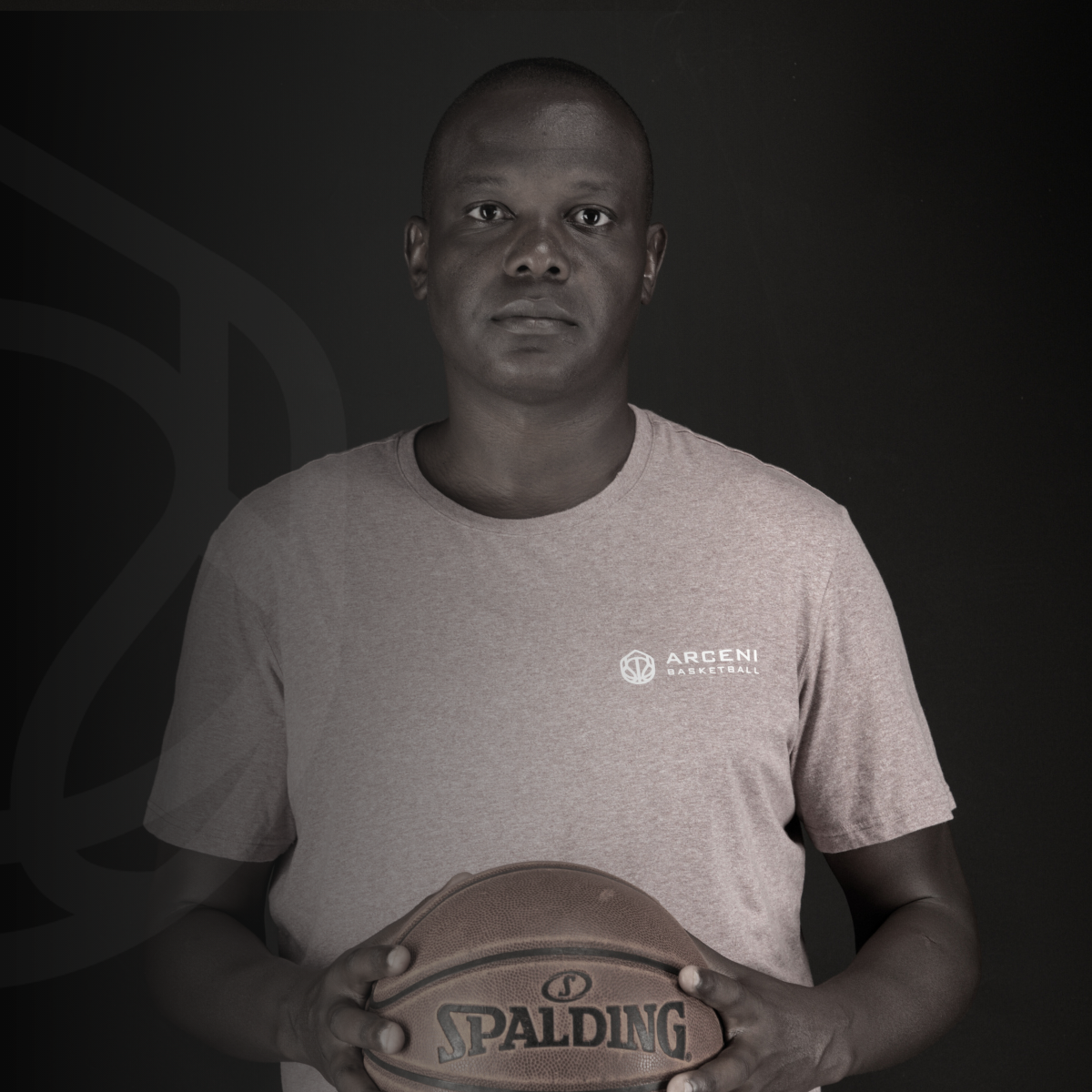 ARCENI basketball coach Almas Ismail holding a basketball